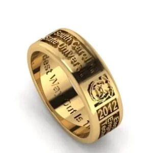 A wide polished gold band featuring detailed engravings for "South Carolina State University," "2012," and "Electronic Engineering Technology," with a custom inspirational quote engraved on the inside.